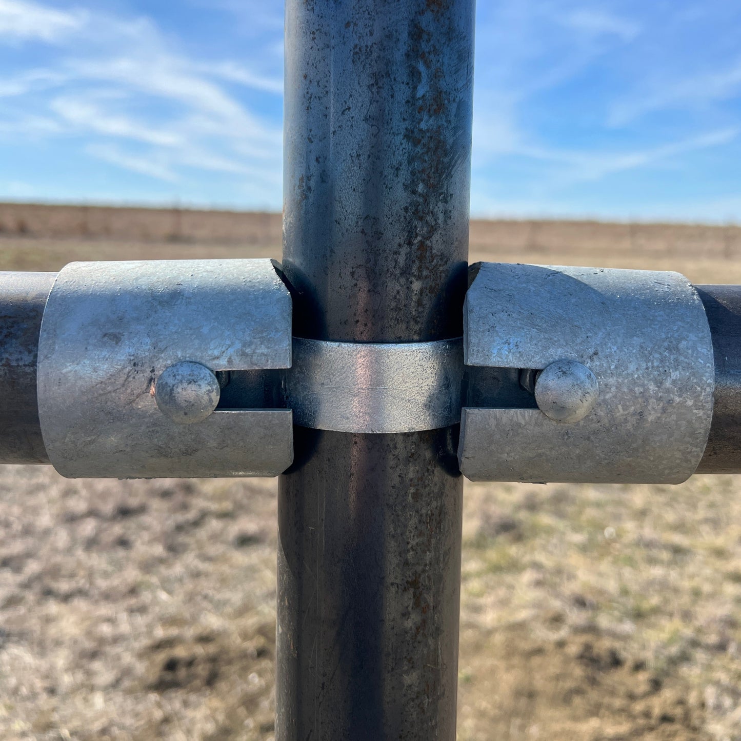 metal fence pipe connector close-up outdoors