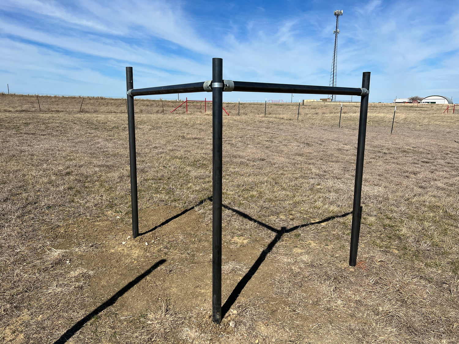metal pipe structure in field sky background