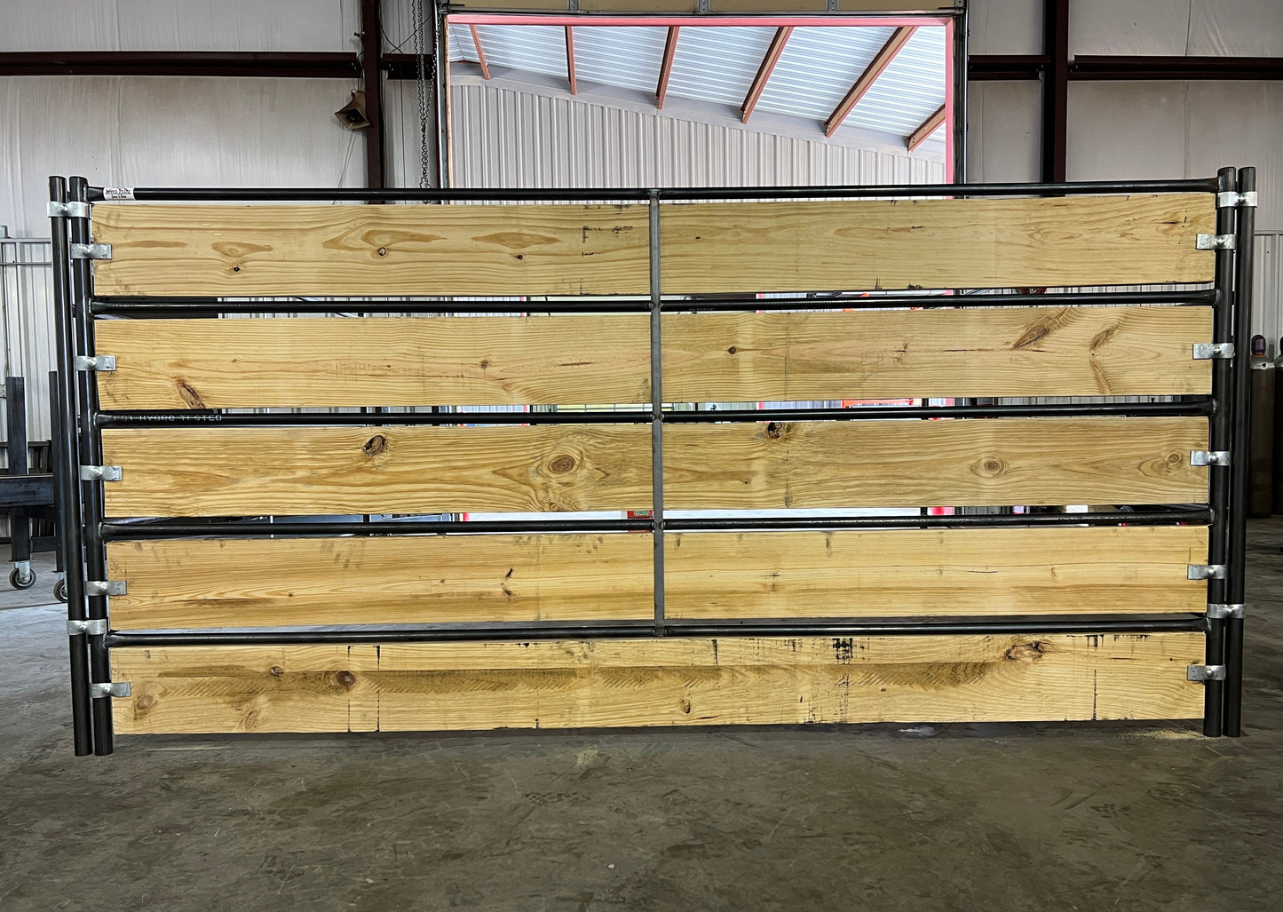metal-frame-wooden-fence-indoor-warehouse