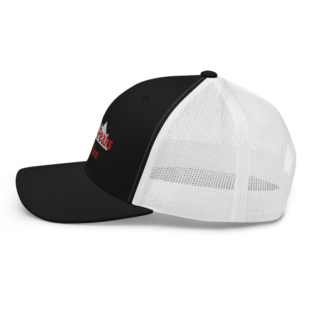 black and white trucker hat with red logo
