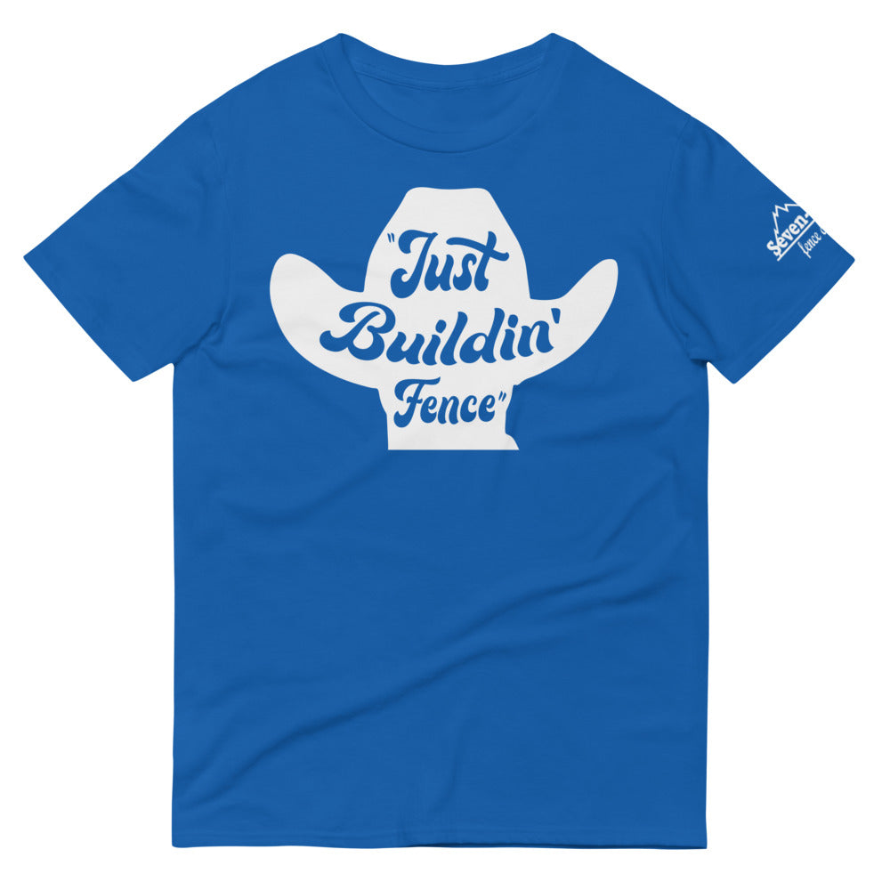 Blue T-shirt with "Just Buildin' Fence" cowboy hat graphic design.