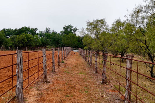 Parallel Lines of Continuous Fencing in Field