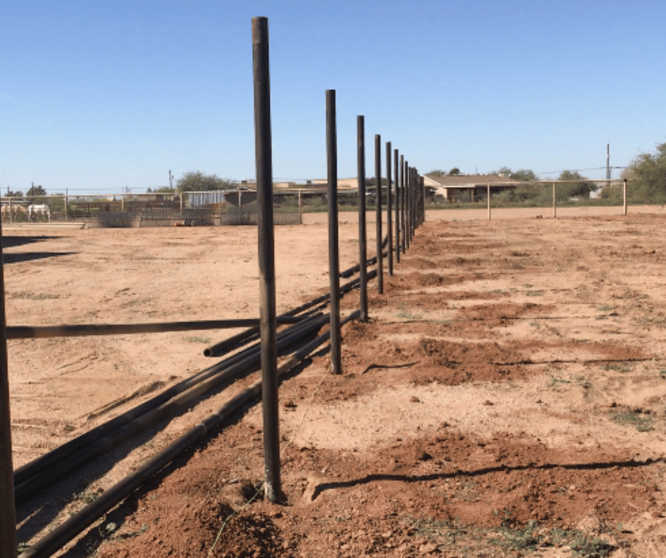 fence posts installation in desert field