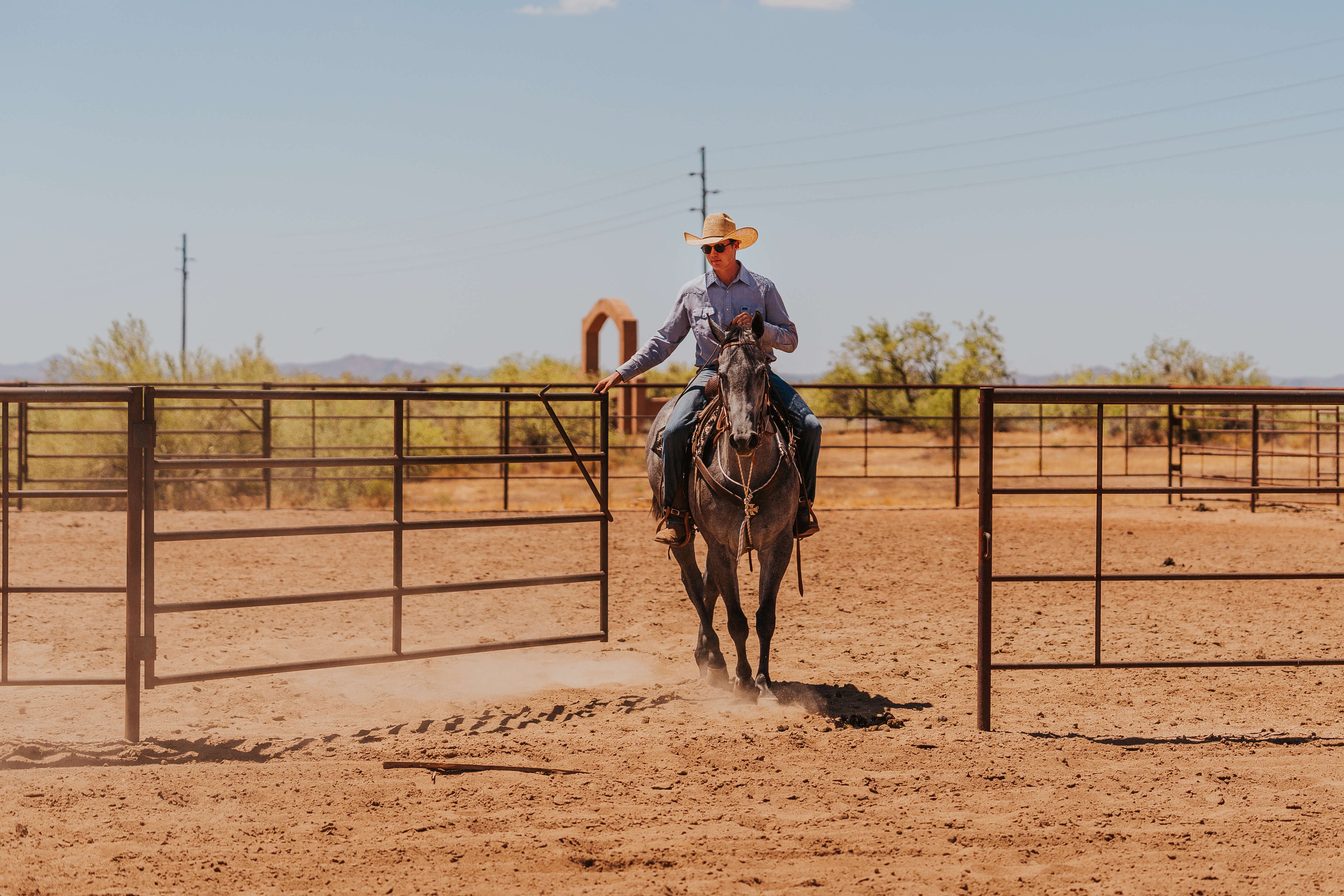 cowboy riding horse in rodeo arena