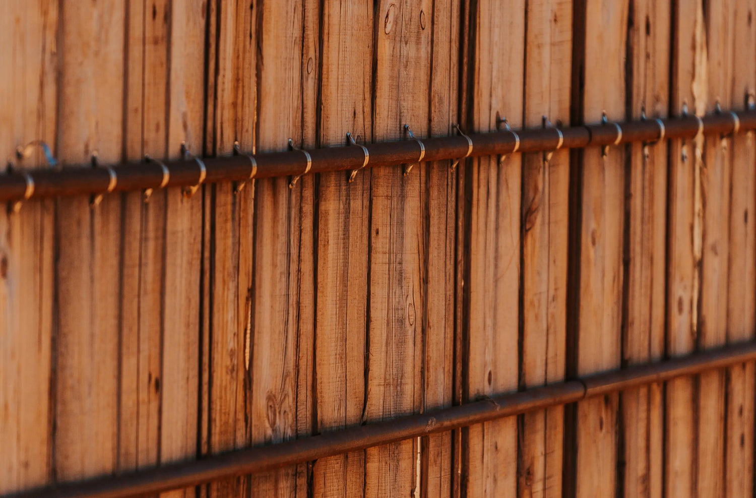 wooden fence with metal poles